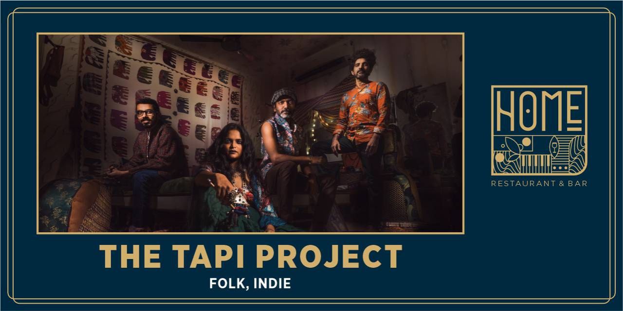 The Tapi Project performing live with a fusion of folk, jazz, and rock music on stage