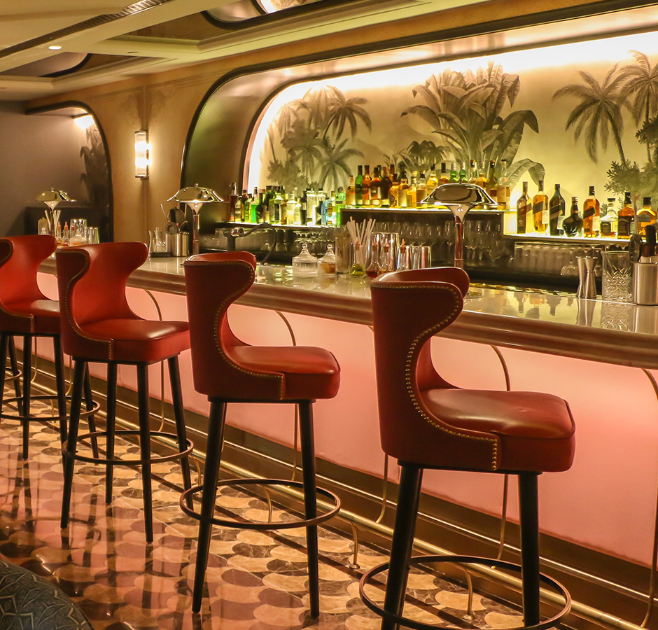 A well-stocked bar at the hotel with a modern design and comfortable seating